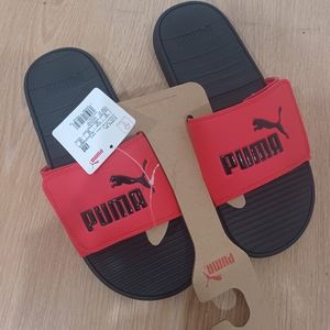 Red and black puma slides